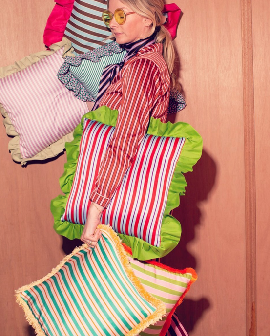Striped cushion with ruffled border